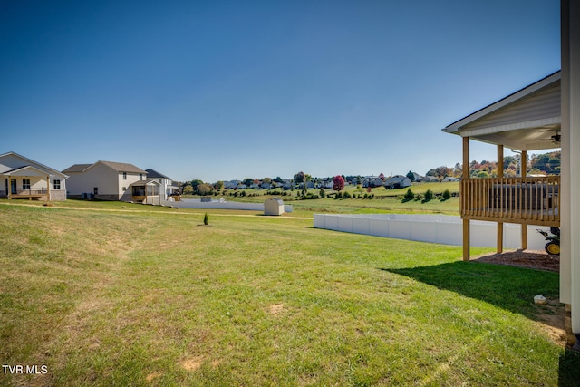 view of yard with ceiling fan