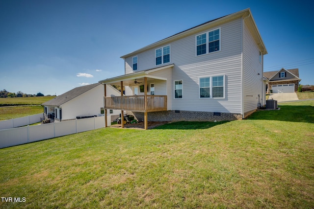 back of house featuring a yard, central AC, a wooden deck, and a garage