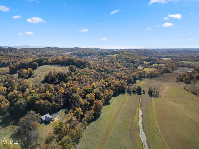 birds eye view of property with a rural view