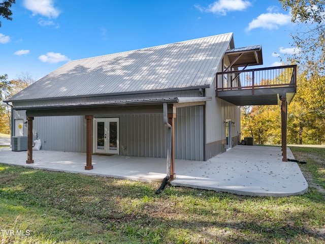 back of house with french doors, a yard, and a patio area