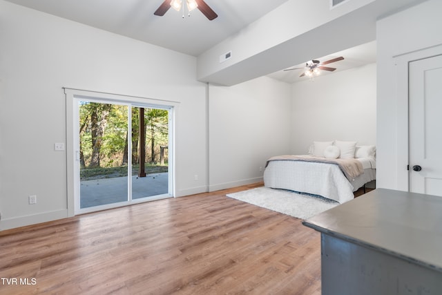 bedroom with ceiling fan, hardwood / wood-style floors, and access to exterior