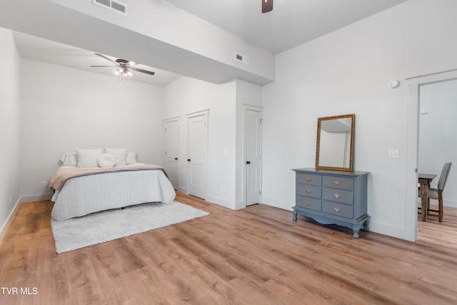 bedroom with light hardwood / wood-style flooring and ceiling fan