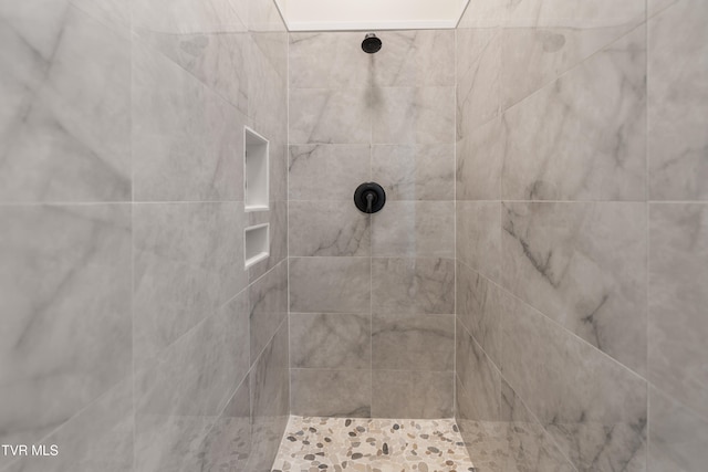 details with a tile shower