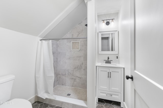 bathroom with vanity, toilet, walk in shower, and tile patterned flooring