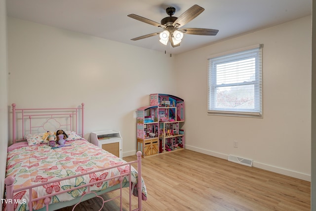 bedroom with hardwood / wood-style flooring and ceiling fan