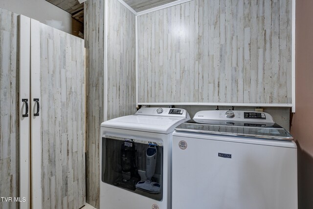 clothes washing area featuring separate washer and dryer