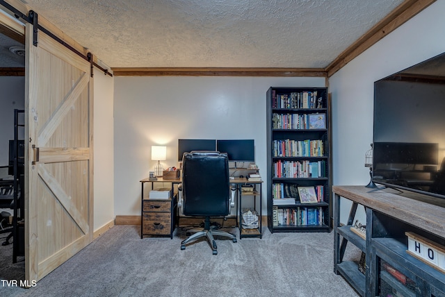 office featuring carpet floors, a barn door, and a textured ceiling