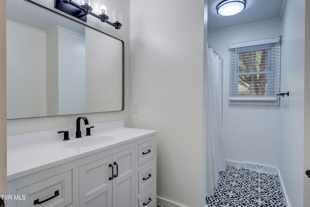 bathroom with vanity, tile patterned floors, and ornamental molding