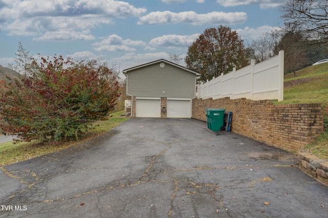 view of side of property featuring a garage