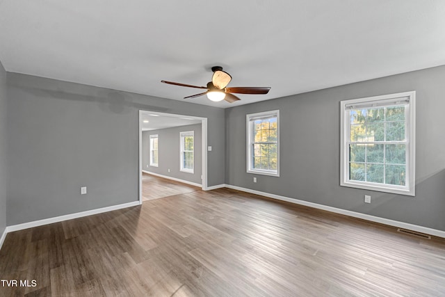 unfurnished room with light hardwood / wood-style floors and ceiling fan