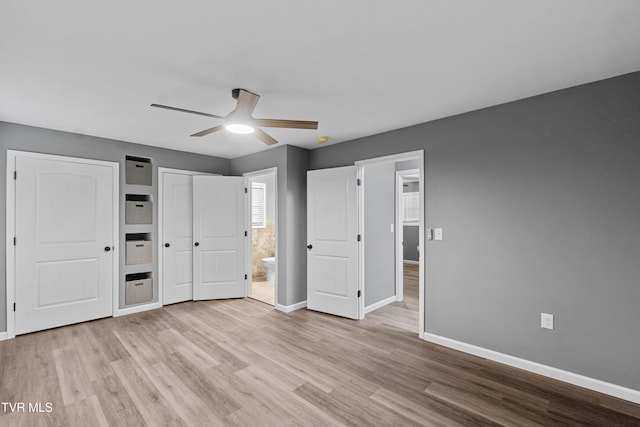 unfurnished bedroom with wood finished floors and baseboards