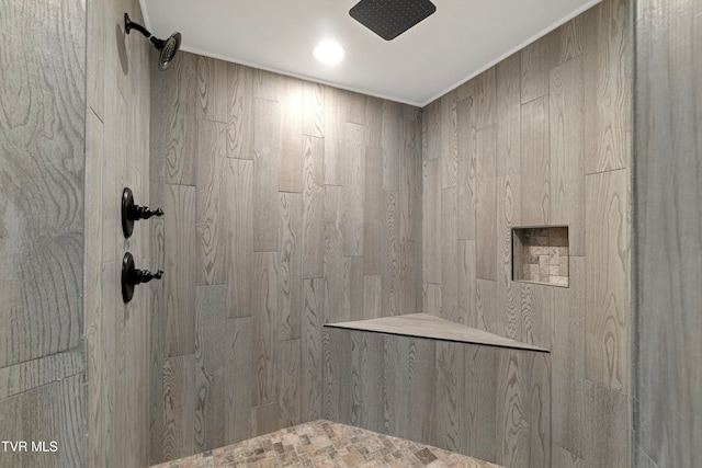 bathroom with a tile shower