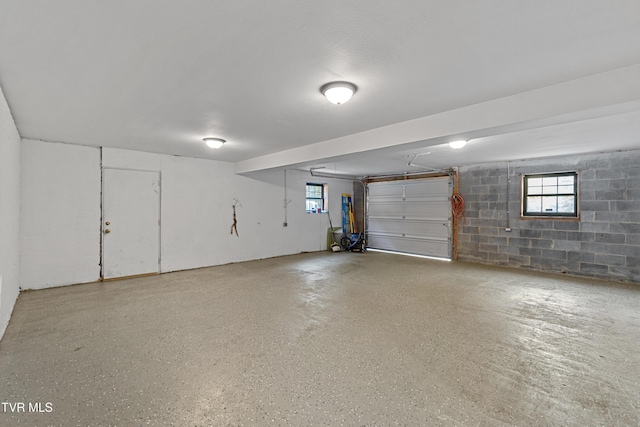 garage featuring concrete block wall