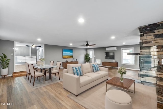 living area featuring ceiling fan, recessed lighting, and light wood-style flooring