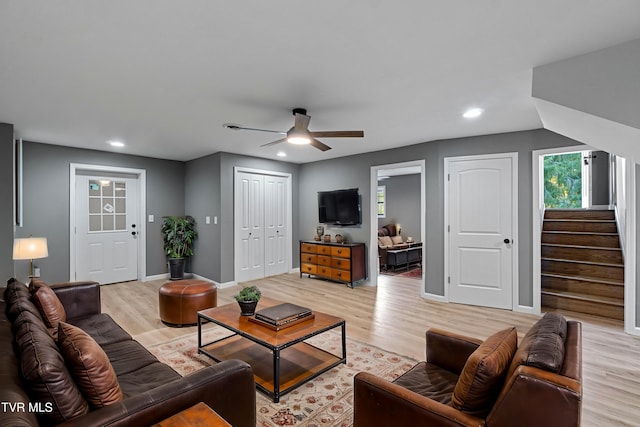 living area featuring recessed lighting, light wood finished floors, ceiling fan, and plenty of natural light