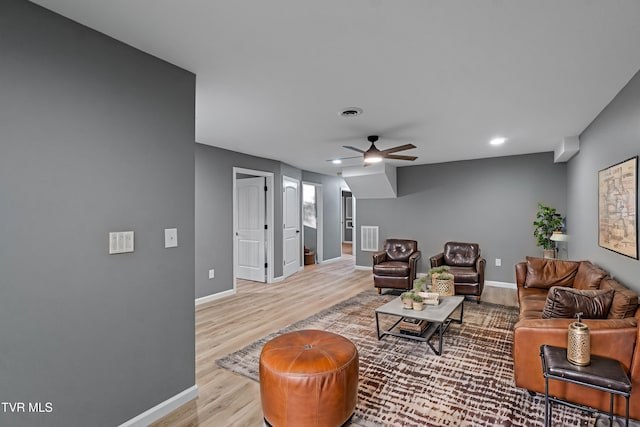 living room with ceiling fan, visible vents, baseboards, recessed lighting, and wood finished floors