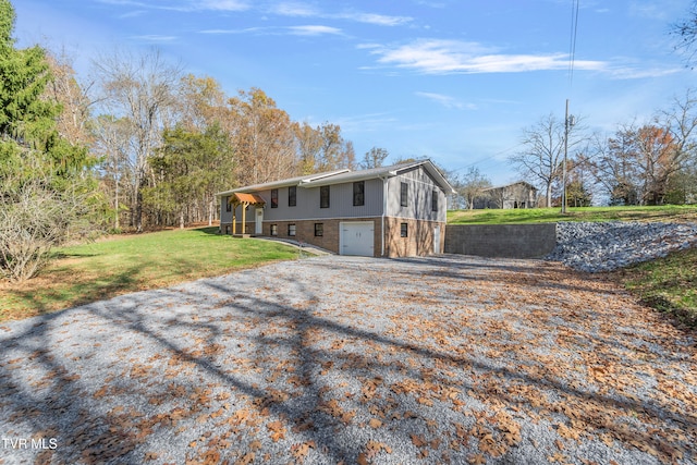 exterior space featuring a yard and a garage