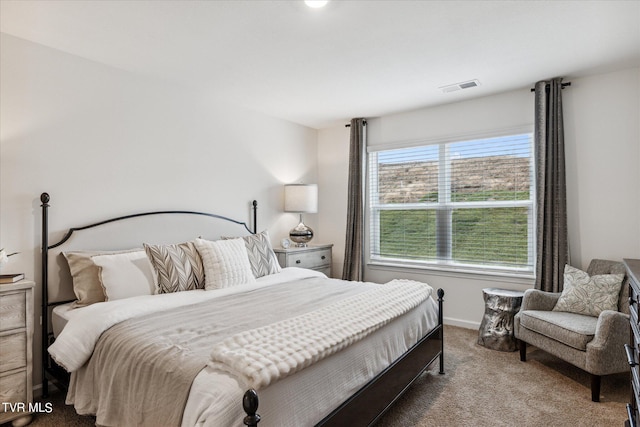 bedroom featuring carpet, visible vents, and baseboards