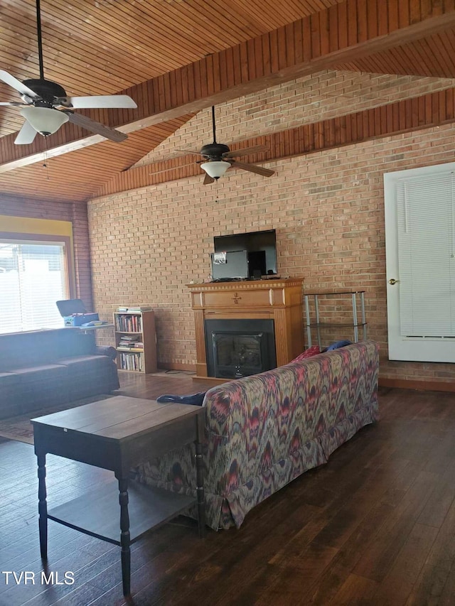 living room with ceiling fan, brick wall, vaulted ceiling, and dark hardwood / wood-style floors