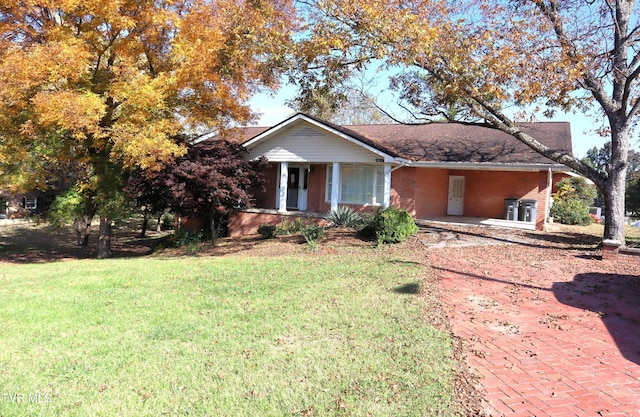 ranch-style house featuring a porch and a front lawn