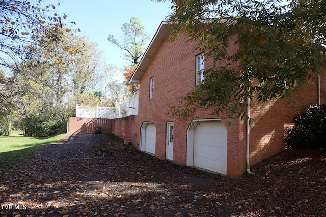 view of side of property featuring a garage