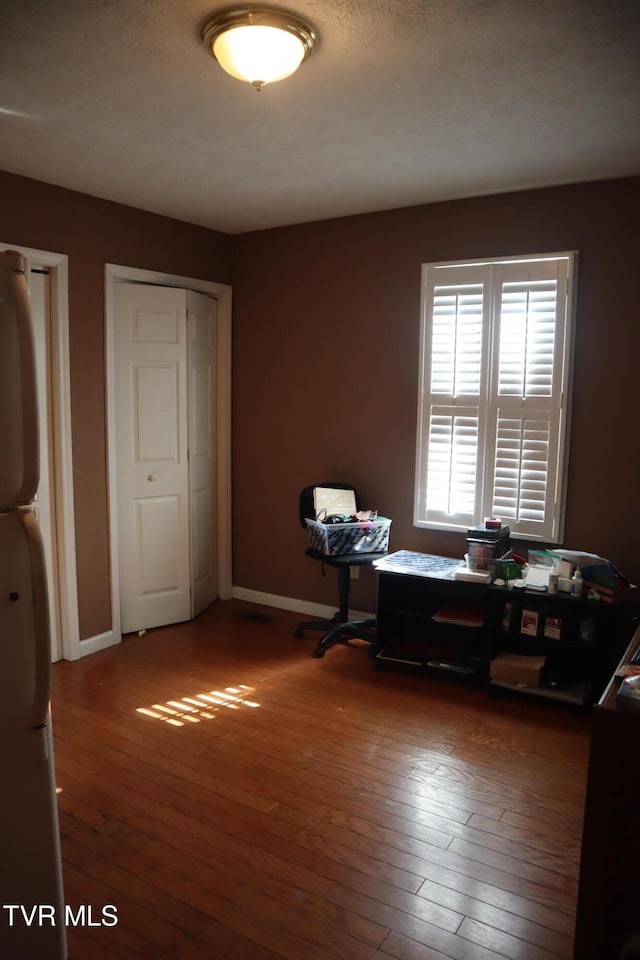 office space featuring hardwood / wood-style floors