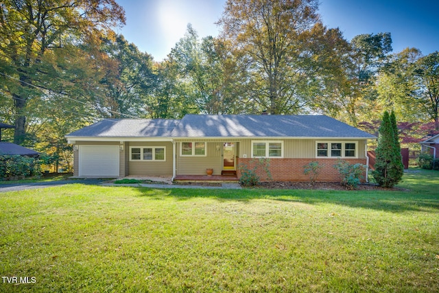 single story home featuring a front lawn and a garage