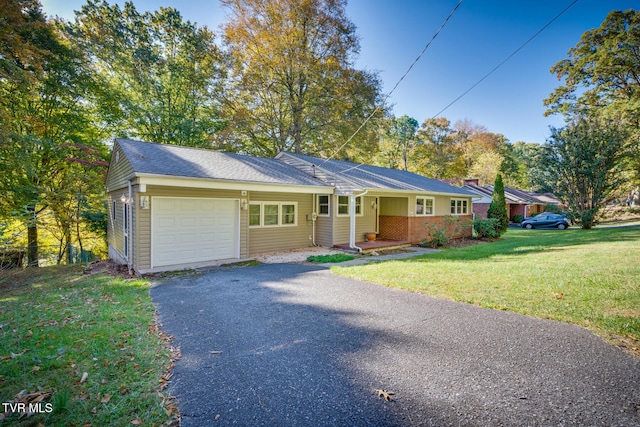 ranch-style home featuring a front lawn and a garage