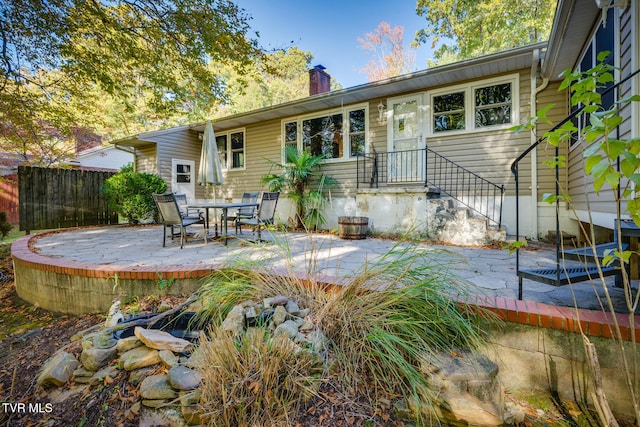 back of house with a patio
