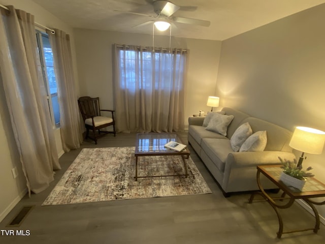 living room featuring ceiling fan, a healthy amount of sunlight, and hardwood / wood-style floors