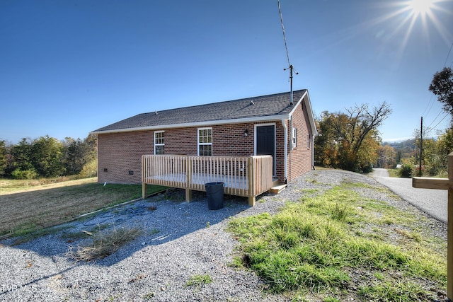 view of front of property featuring a wooden deck