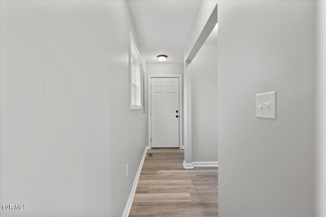 hallway with light hardwood / wood-style flooring