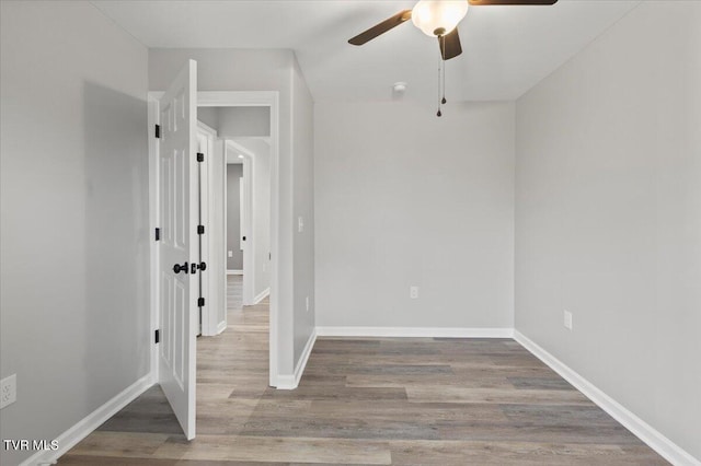 unfurnished room with ceiling fan and light wood-type flooring