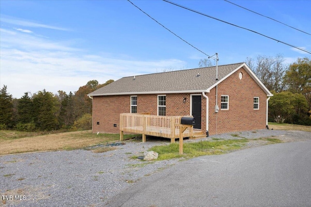 view of front of property featuring a wooden deck