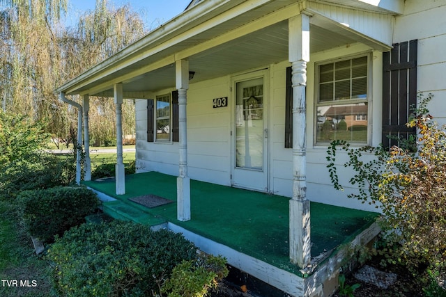 doorway to property featuring a porch