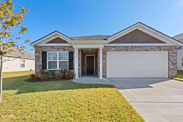 view of front of property featuring a garage and a front yard