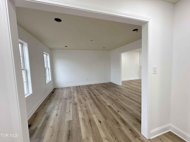 spare room featuring light hardwood / wood-style flooring