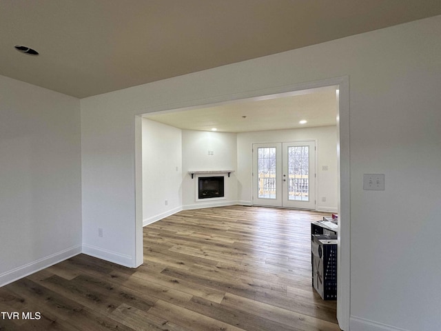 unfurnished living room featuring wood-type flooring