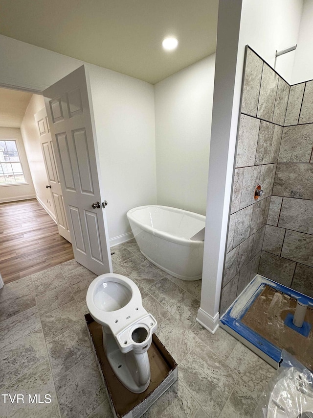 bathroom featuring a washtub