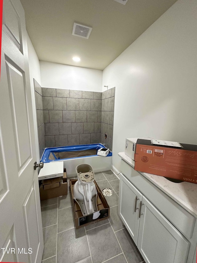 bathroom with tile patterned flooring