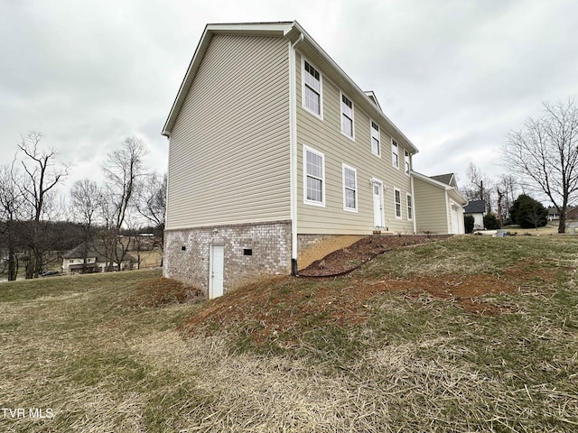 view of property exterior featuring a yard