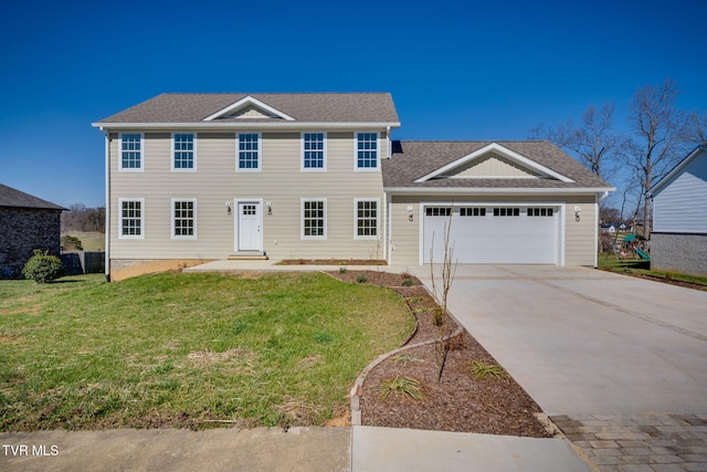 colonial house featuring a garage, roof with shingles, concrete driveway, and a front yard