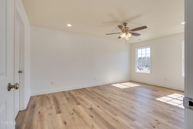 spare room with recessed lighting, light wood-type flooring, baseboards, and ceiling fan