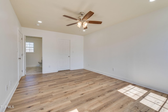 unfurnished bedroom with a ceiling fan, baseboards, light wood-style flooring, recessed lighting, and connected bathroom