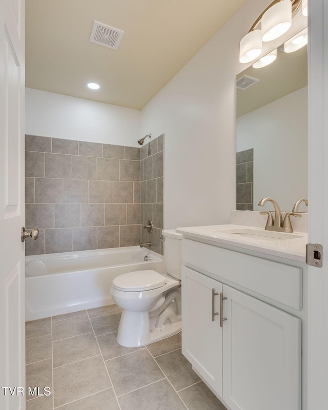 full bath featuring visible vents, toilet, vanity, and tile patterned flooring