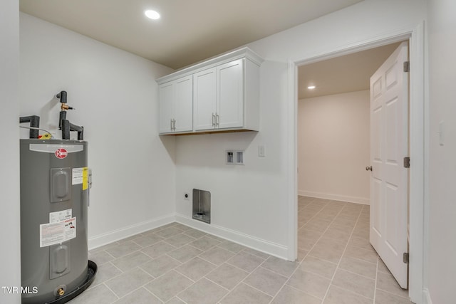 clothes washing area with baseboards, washer hookup, water heater, cabinet space, and electric dryer hookup