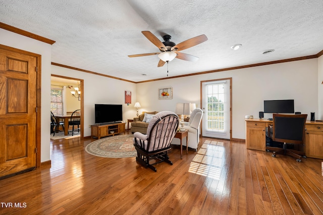 living room with hardwood / wood-style floors and a textured ceiling