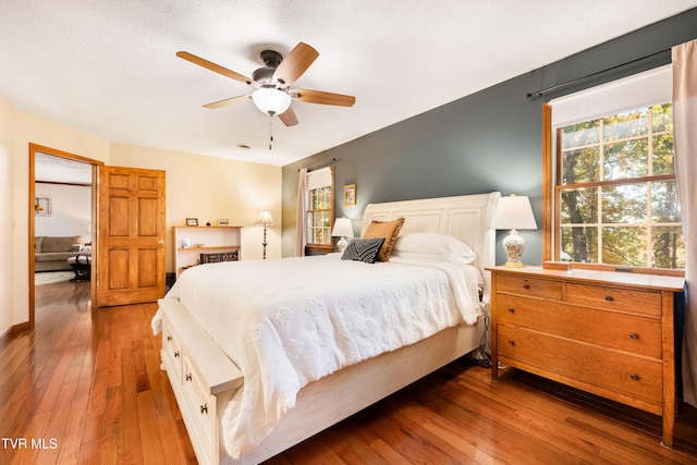 bedroom featuring hardwood / wood-style floors and ceiling fan