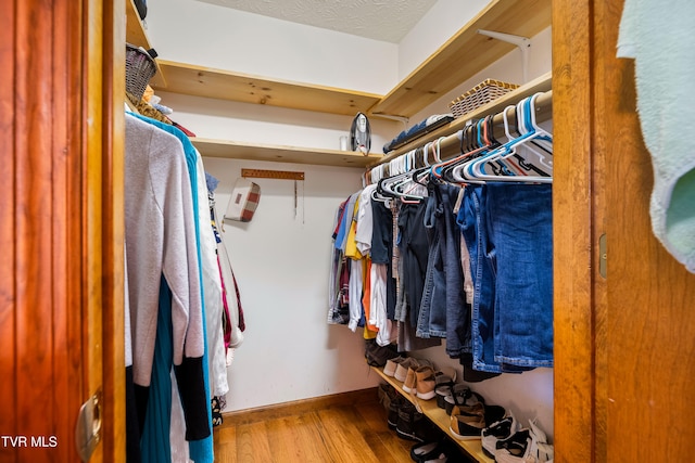 walk in closet featuring light hardwood / wood-style floors