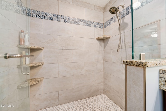 bathroom featuring a tile shower